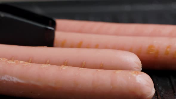 Meat Sausages Are Fried On Grill