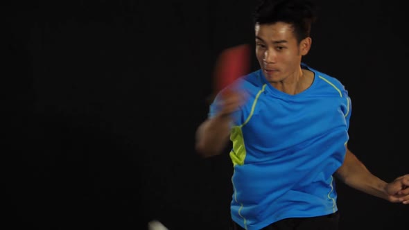 Young Sports Man Table Tennis Player Is Playing On Black Background