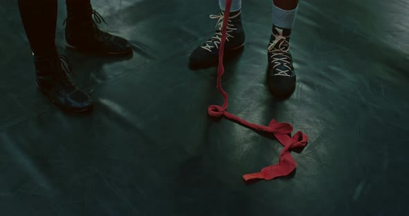 Athlets are Wrapping Hands By Protective Tape in Fight Club Closeup of Feet of Two Men  Prores