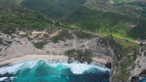 Foamy waves crashing on the Diamond beach. Aerial parallax shot of the tropical secluded sandy beach