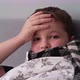 a Little Boy is Sick Lies in Bed in a Scarf Holds His Head - VideoHive Item for Sale