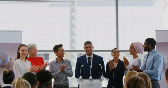 Businessman standing on the podium with his colleagues in the business seminar 4k