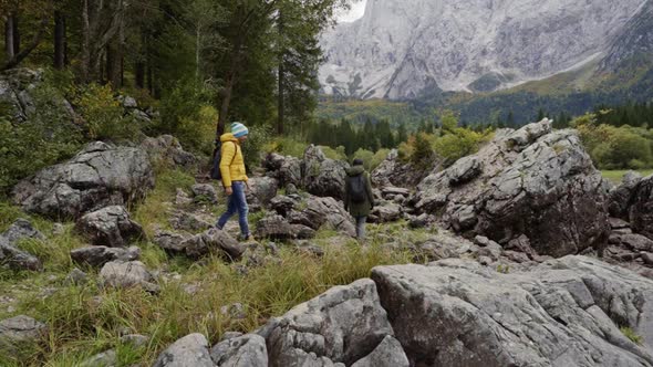Hikers near Fusine lake, Italy