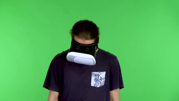 Portrait of a Young Man with a Virtual Reality Headset or 3d Glasses on His Head