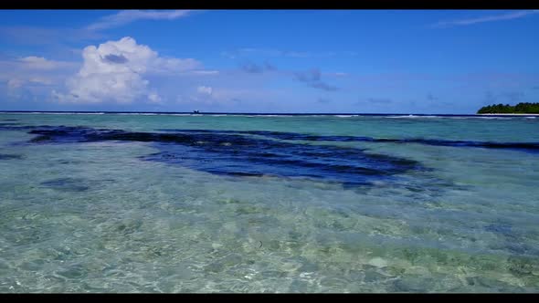 Aerial scenery of tropical resort beach trip by blue lagoon and white sandy background of a dayout n