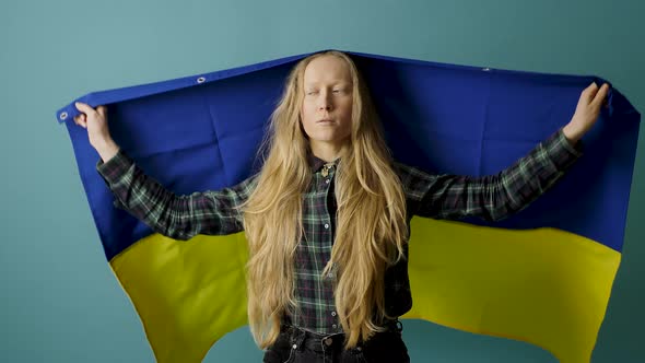 Young Woman with Ukrainian Flag During the War