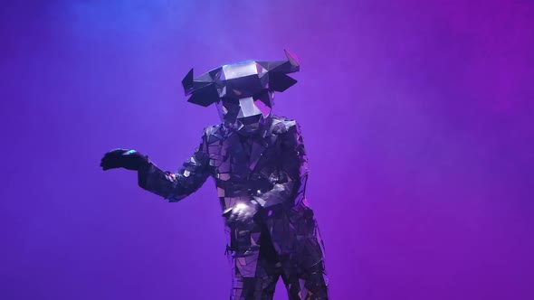 Shiny Bull in Costume Made of Mirrors Dancing Robot Dance on Neon Purple Studio Background