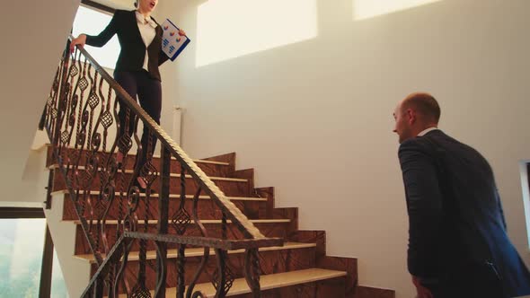 Business Colleagues Meeting on Stairs and Greeting