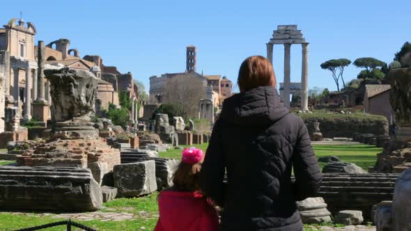 Woman with her daughter admire Roman Forum, Rome, Italy