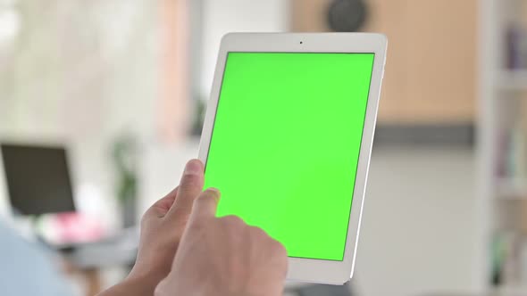 Chroma Key Rear View of Young African American Man Using Tablet