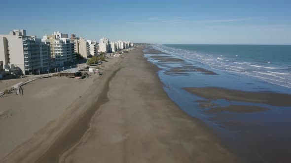 Aerial Drone view of empty beach with low tide, in Monte Hermoso, Argentina