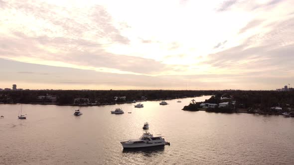 Aerial Video Rising Boats In The Lake At Sunset