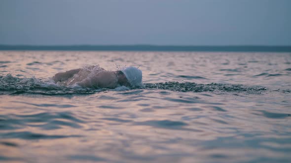 A Man Is Using Butterfly Stroke While Swimming in the Sea