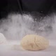 Cloud of White Flour Caused By Chef in Dark Suit Slamming Glob of Dough Onto the Table - VideoHive Item for Sale