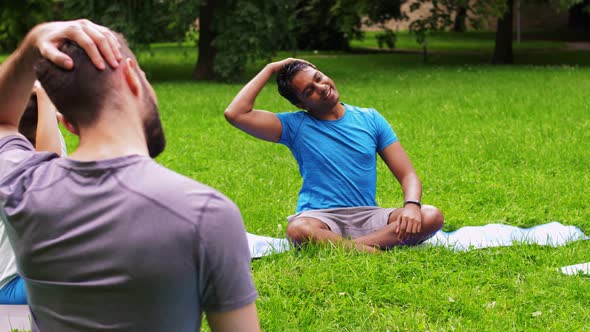 Group of People Exercising at Summer Park