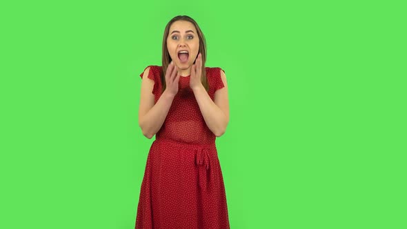 Tender Girl in Red Dress Is Frustrated Saying Oh My God and Being Shocked. Green Screen
