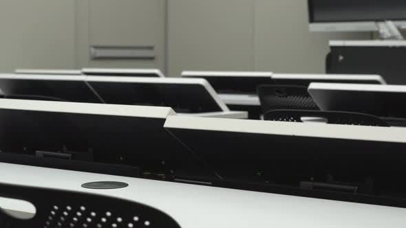 Close Up of Desks with Motorized Monitor Lift Screens