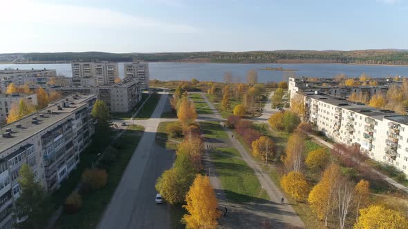 Aerial view of alley and pond in a provincial autumn town 18