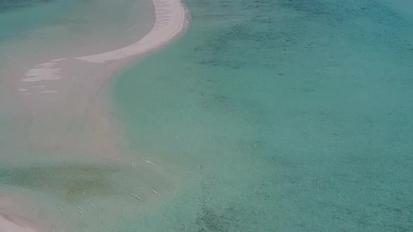 Aerial drone texture of coast beach by blue ocean and sand background