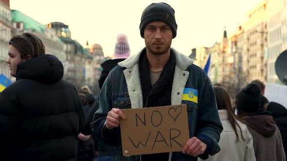 Protester with placard at demonstration against war in Ukraine, Prague.