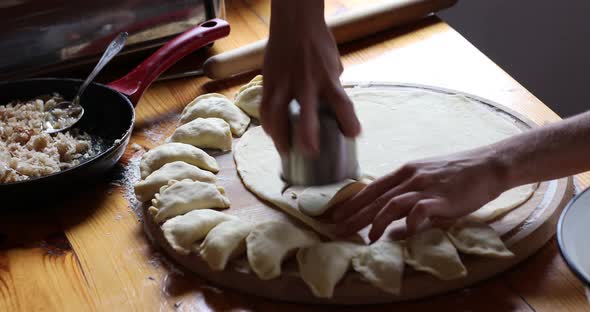 The raw traditional Ukrainian hand-made vareniki (dumpling) with cabbage inside