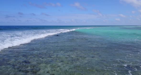 Tropical aerial island view of a paradise sunny white sand beach and aqua blue ocean background in 4