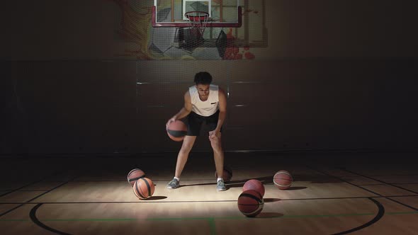 Young Man Dribbling Basketball