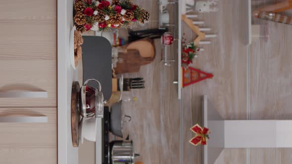 Vertical Video Empty Xmas Decorated Kitchen with Nobody in It is Ready for Christmas Morning Dessert