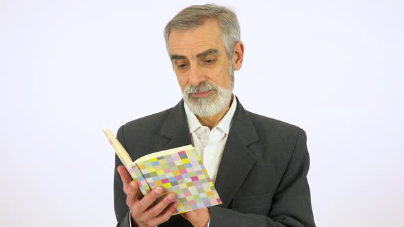 An Elderly Man Reads a Book - White Screen Studio