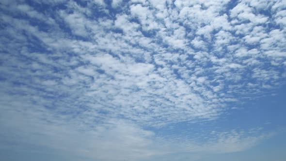 Fluffy cloud time lapse on a sunny day.