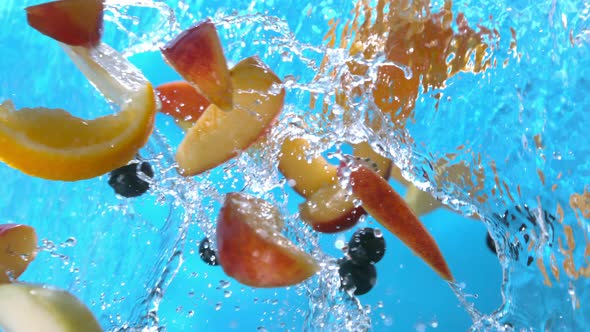 Fruits Peach Slices Orange Black Currant Apple Splashing Into Water Pouring Down In Slow Motion 4K