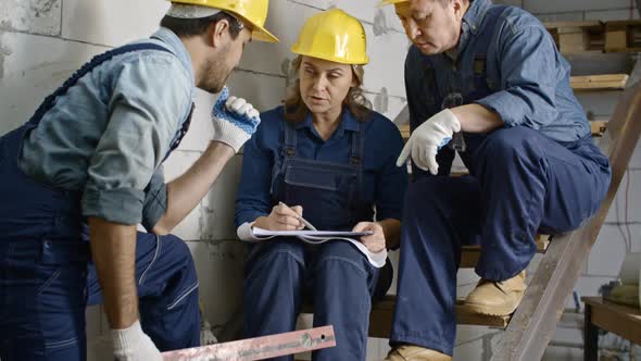 Builders Discussing Plans