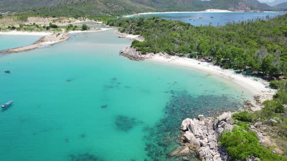 Tropical azure water at Binh Tien Beach at pristine coast of Vietnam