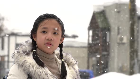 Cute Asian Girl Enjoy With Snow On Winter Day