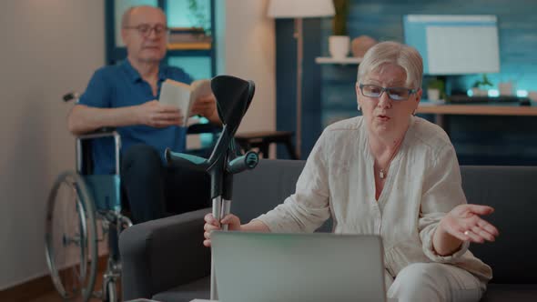 Senior Woman Using Laptop to Have Online Conversation