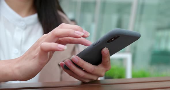 Business woman use cellphone fro online