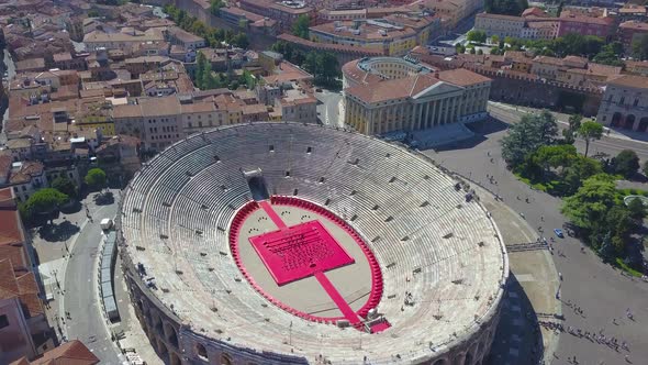 Aerial panoramic view of Arena di Verona, Italy. The drone hovers over the Arena, the City Hall