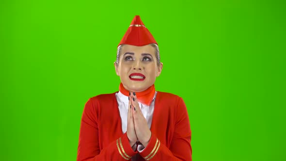 Stewardess Crossed Her Fingers. Green Screen