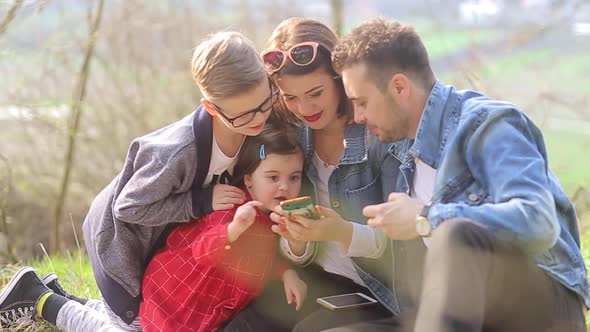 happy family around the campfire, picnic