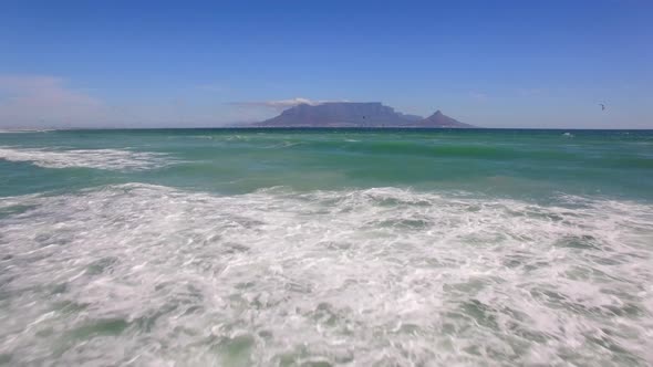 Travel drone Table Mountain, Table Bay, kiteboarders, Bloubergstrand, Cape Town, South Africa.