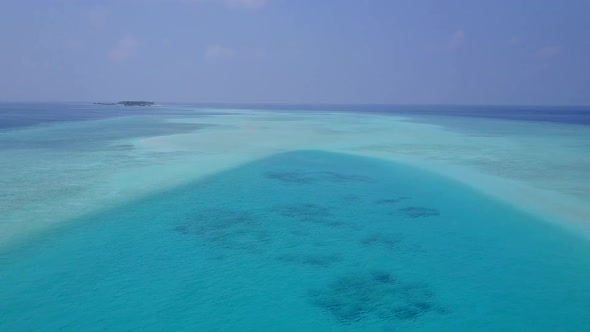 Aerial seascape of marine seashore beach by clear sea with sand background