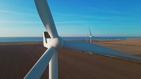 Aerial Zoom Out View of Wind Turbine Farm on Agriculture Fields in Ukraine