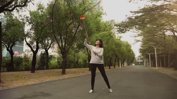 Taiwanese woman playing with a Chinese Yo-Yo