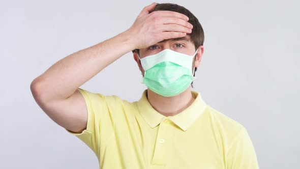 Sick Man Touching His Forehead To Check Body Temperature Wearing Protection Disposable Mask