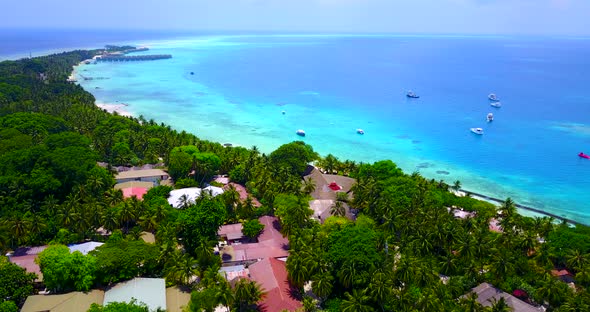 Beautiful birds eye island view of a sunshine white sandy paradise beach and blue sea background