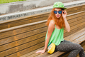 young stylish hipster ginger woman, sitting on bench - PhotoDune Item for Sale