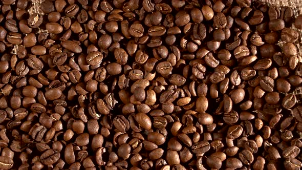 Coffee Beans on Burlap Sacking, Background with Fleeting Shadow, Rotation, Cam Moves To the Left