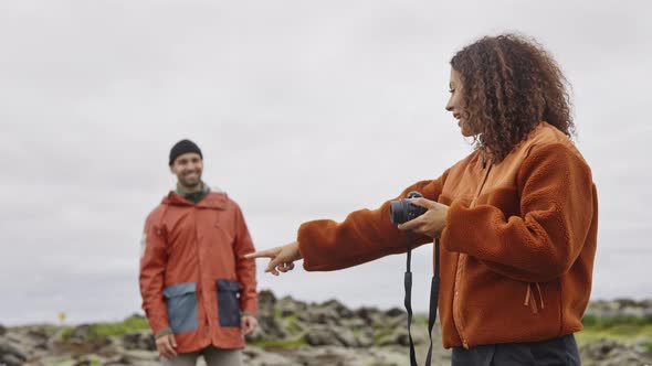 Woman On Hike With Camera Directing Man Where To Stand