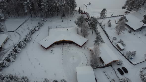 Beautiful Winter Drone Footage Over Forest and Lake