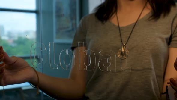 Woman Holding Glass Global Sign alt